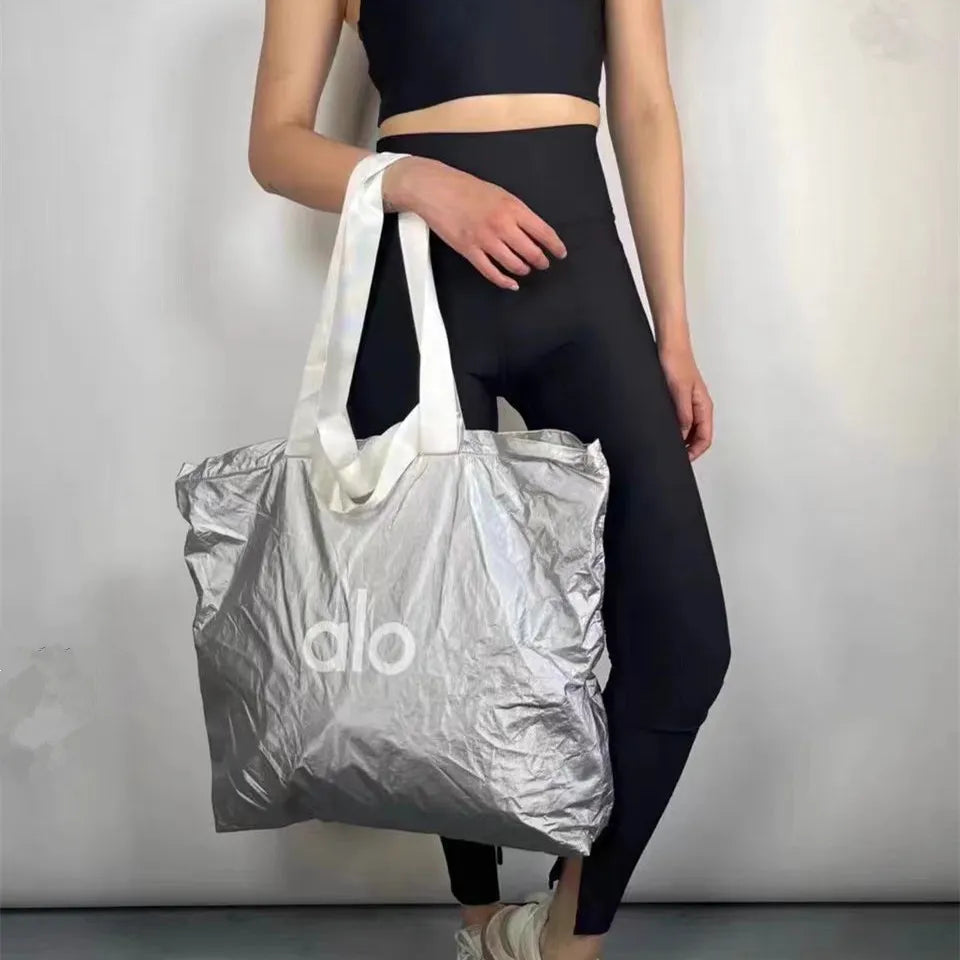 alo yoga shopping bag Alo Yoga Silver Textured Shopping Tote