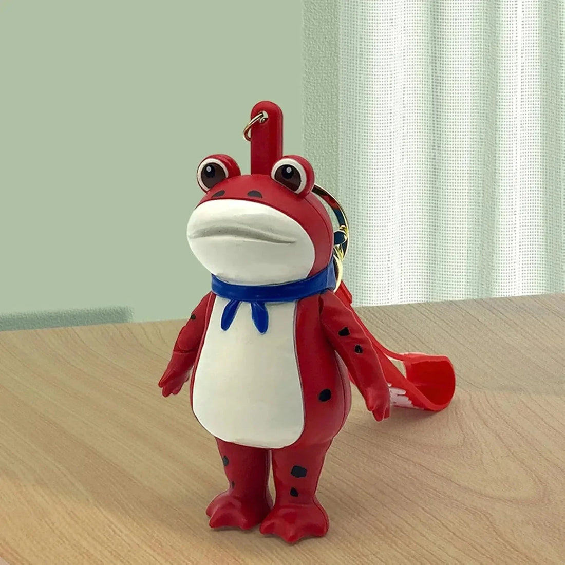 Porte-clés grenouille à appuyer pour saluer 