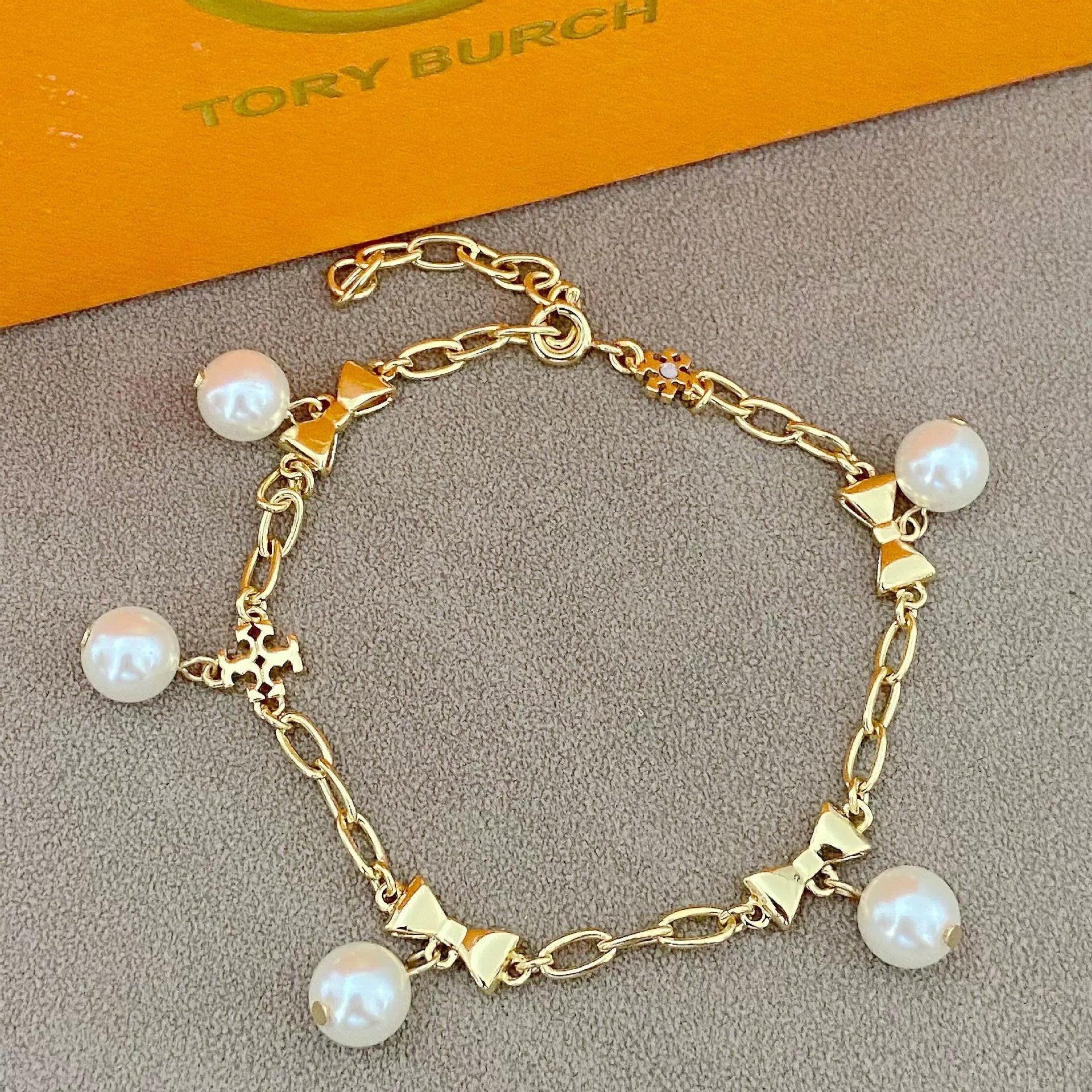 T-Luxe Pearl Bow Charm Bracelet
