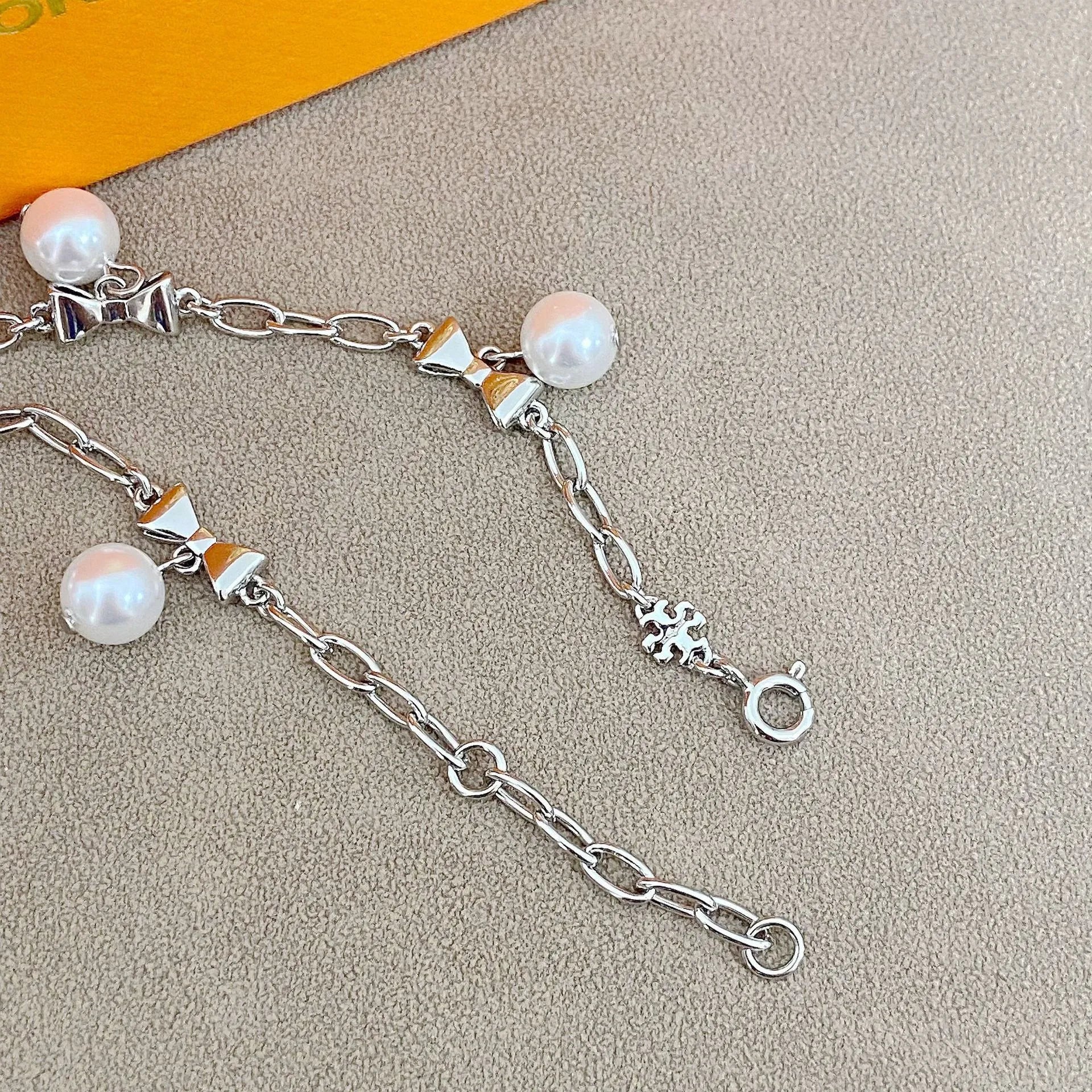 T-Luxe Pearl Bow Charm Bracelet