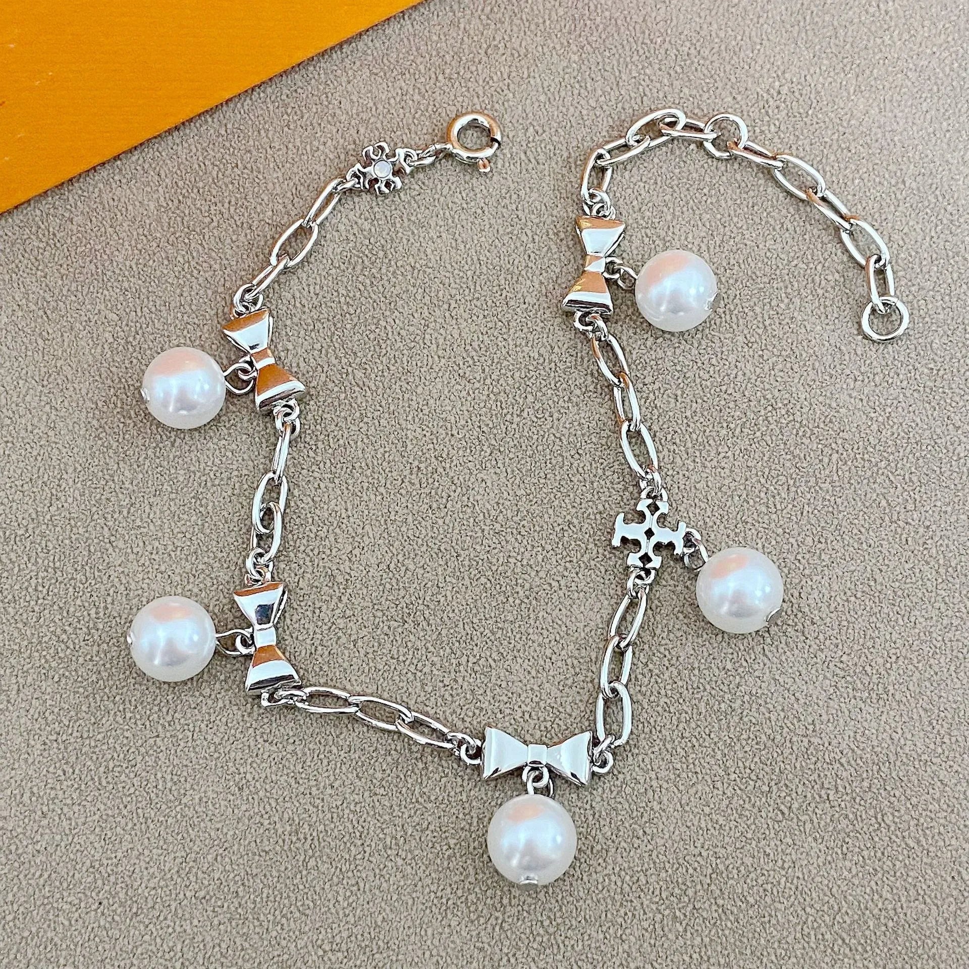 T-Luxe Pearl Bow Charm Bracelet