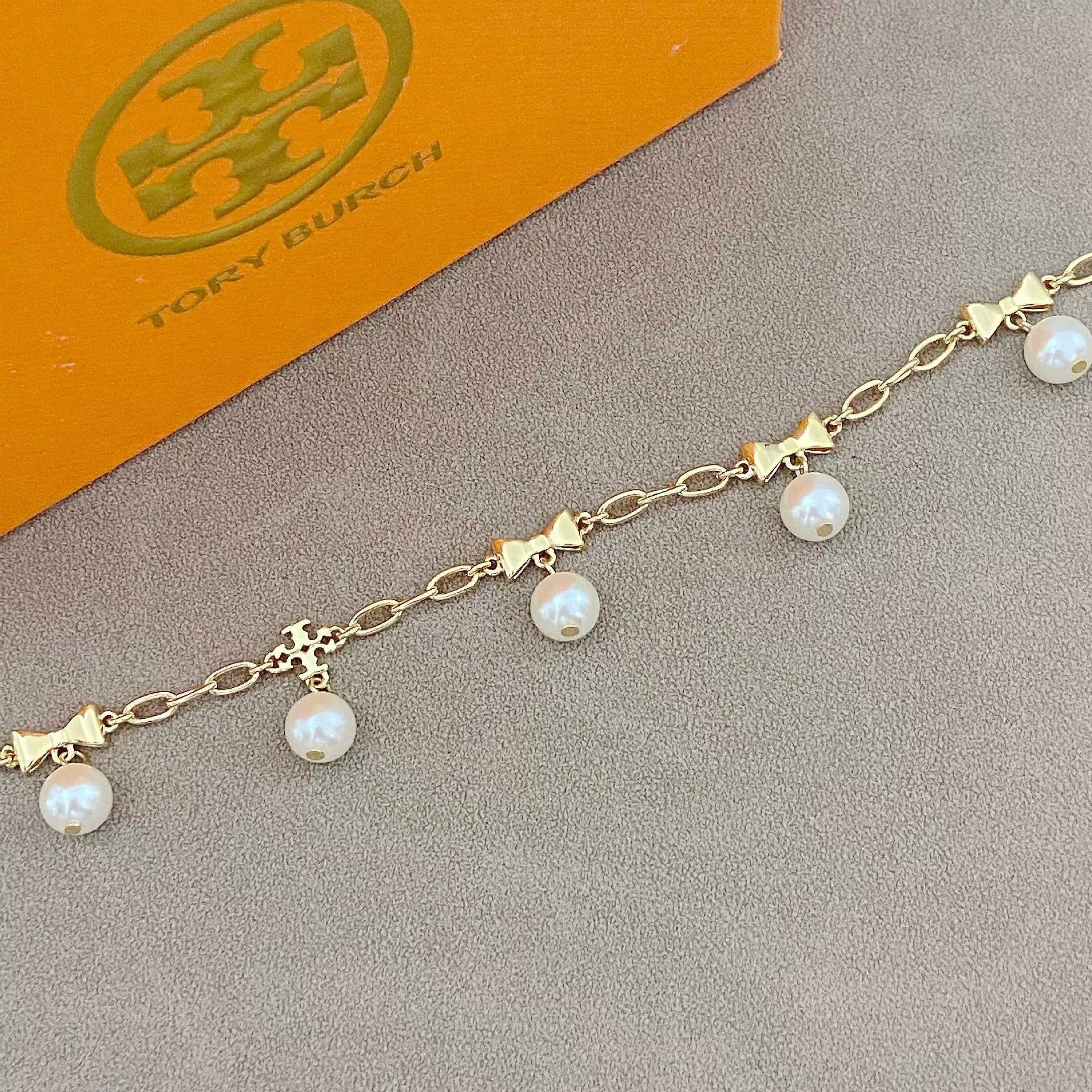 T-Luxe Pearl Bow Charm Bracelet