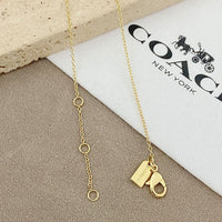 Trainer Luxe Radiant Heart Monogram Pendant