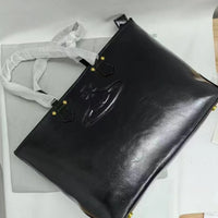 VW Molded Orb Leather Shopper Tote Bag