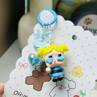 Small figurine of a cartoon character on a decorative card with illustrations and text.