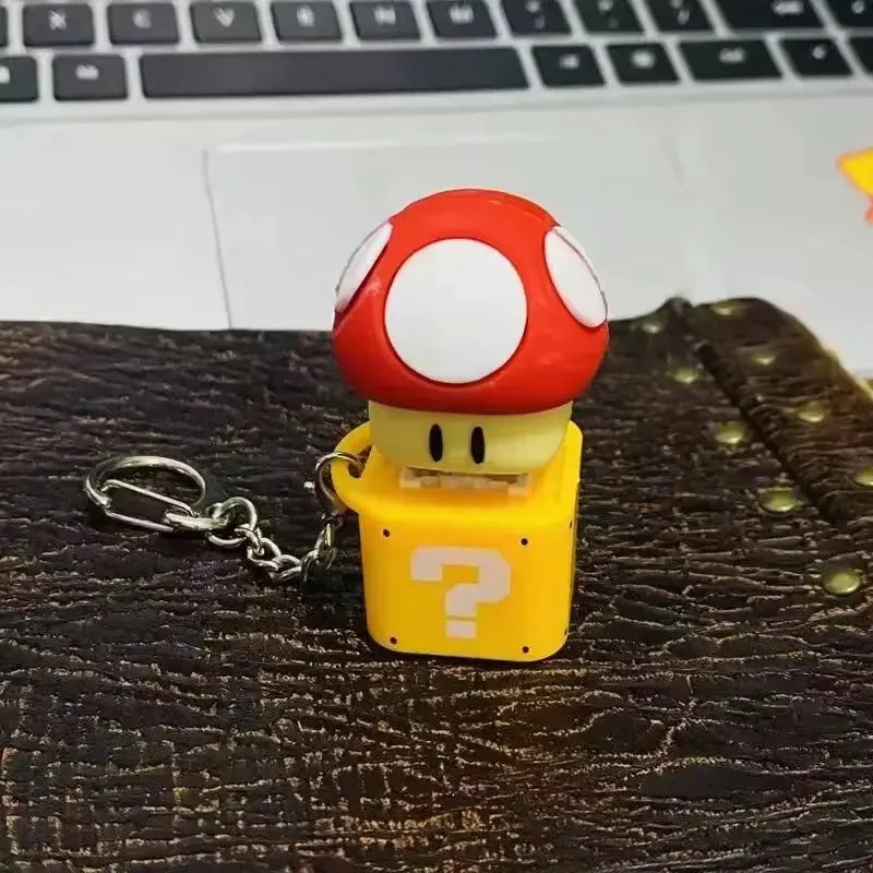 سلسلة مفاتيح على شكل كتلة أسئلة على شكل ضفدع 