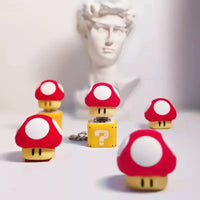 سلسلة مفاتيح على شكل كتلة أسئلة على شكل ضفدع 