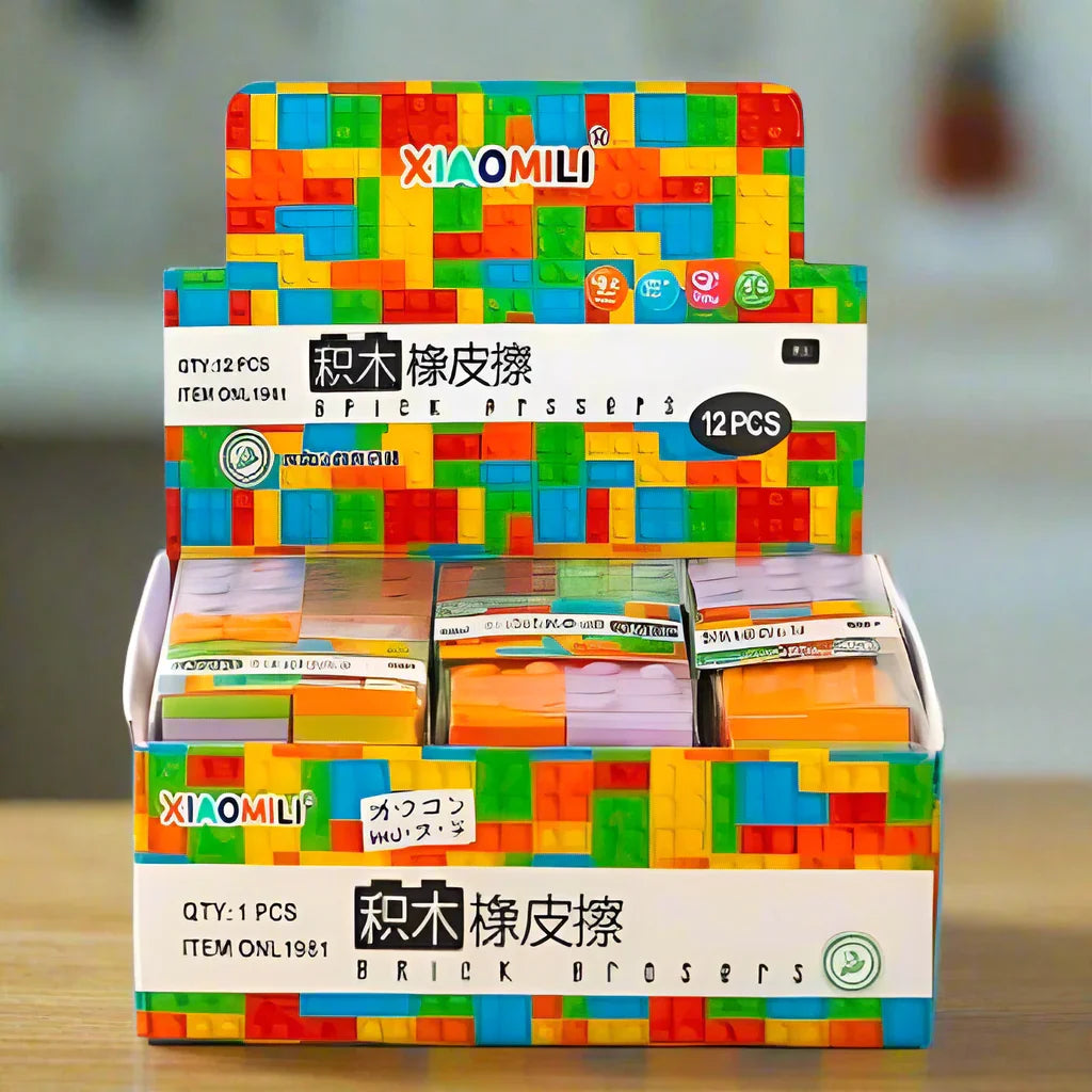 Display box of Xiaomi erasers with colorful packaging on a wooden surface.