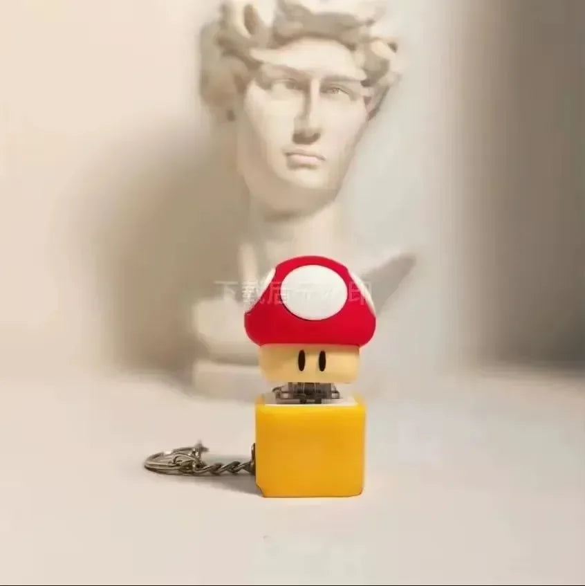 سلسلة مفاتيح على شكل كتلة أسئلة على شكل ضفدع 