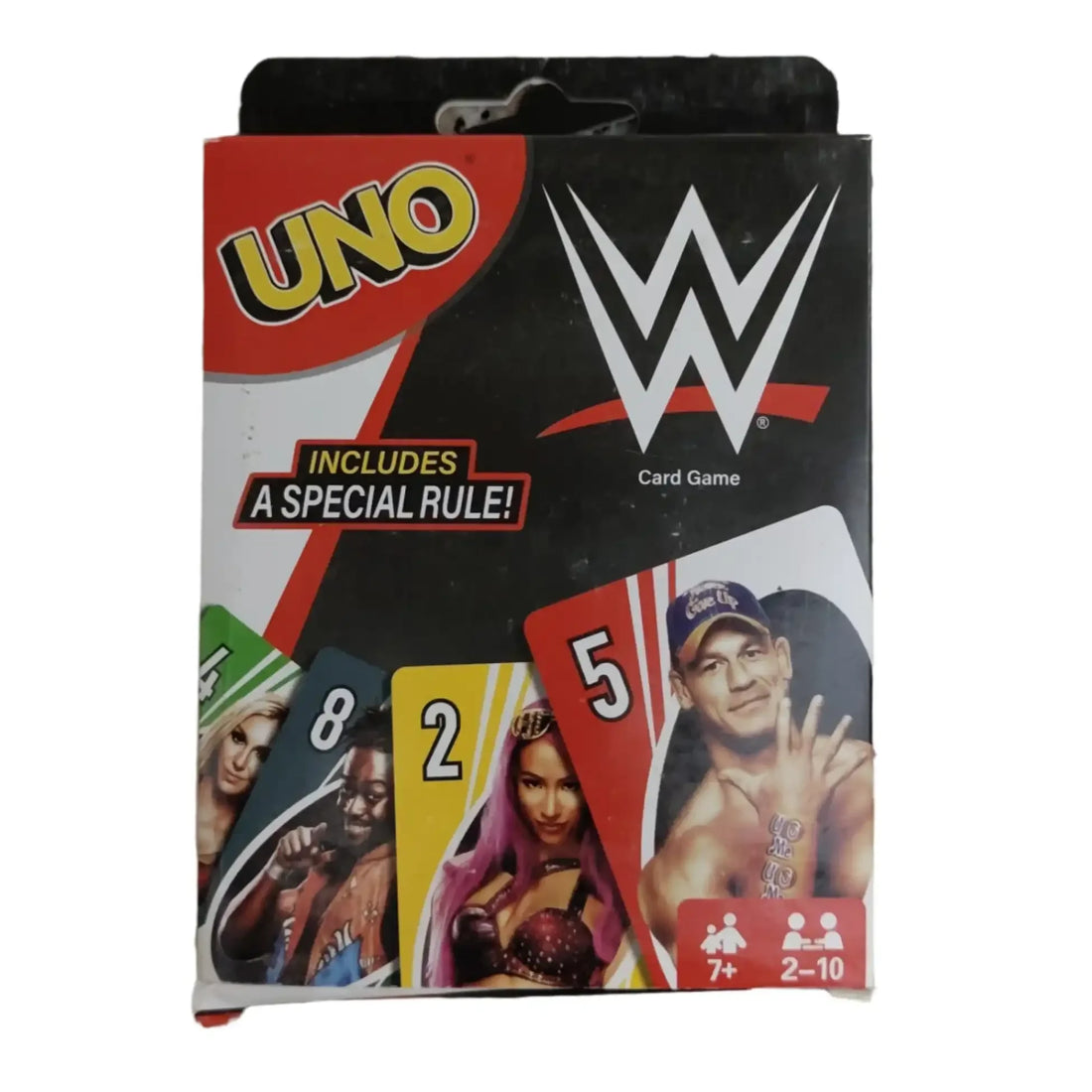WWE-themed UNO card game packaging on a granite surface