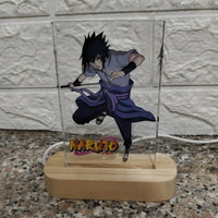 Anime character lamp with 'Naruto' branding on a marble surface.