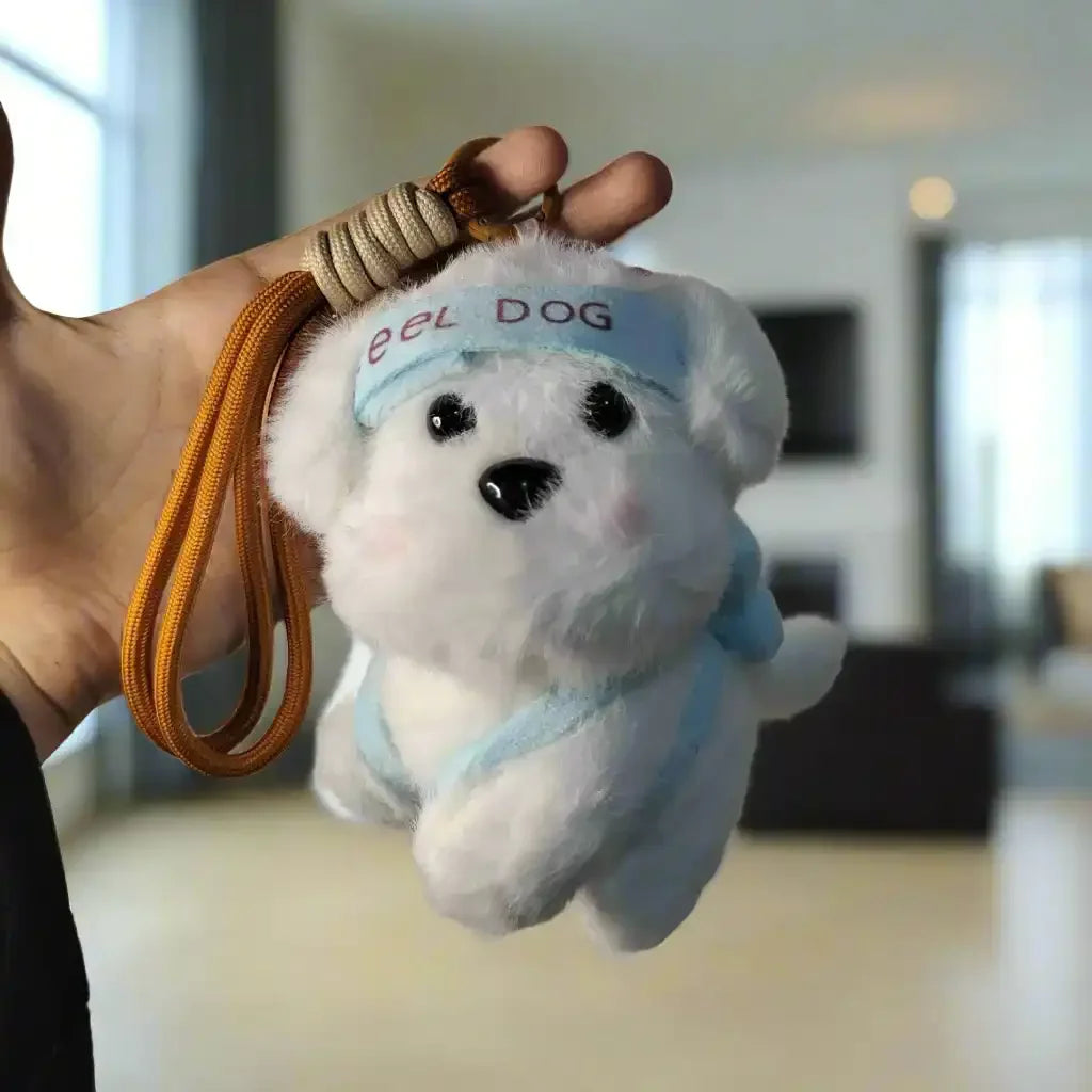 White plush dog toy with a blue bandana held against a light textured wall.