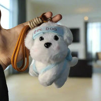 White plush dog toy with a blue bandana held against a light textured wall.