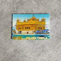 Colorful magnet of the Golden Temple on a concrete surface