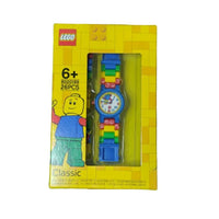 LEGO watch in packaging on a grass background