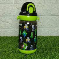 Children's minecraft water bottle with green lid and character design on grass against a tiled wall background