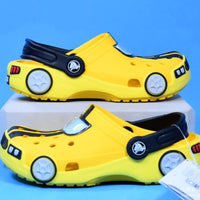 Yellow children's shoes with car design on a blue background