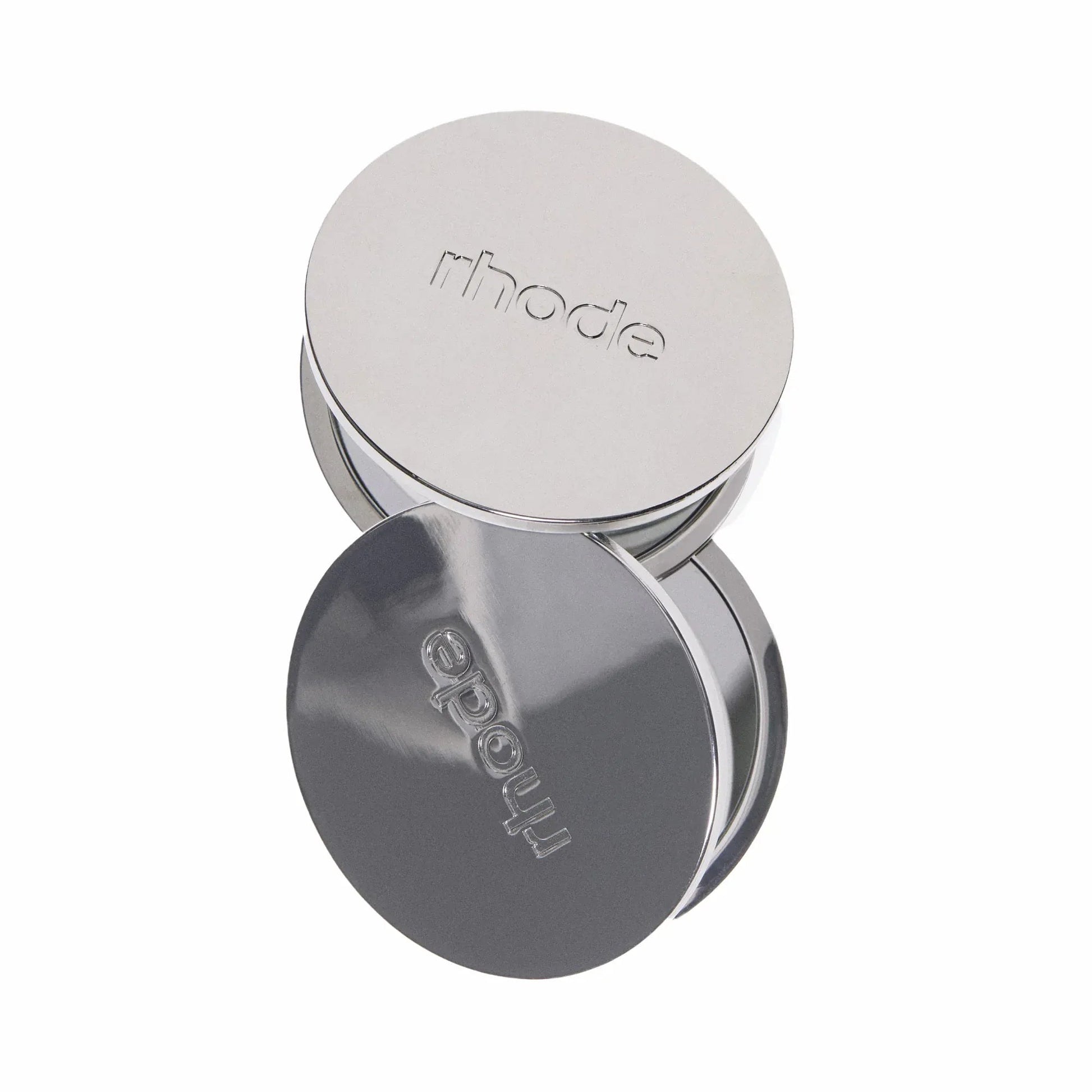 Silver circular mirror with 'rhode' branding on a white background