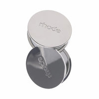 Silver circular mirror with 'rhode' branding on a white background
