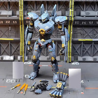 Mechanical toy figure with parts on a gray platform against a industrial background