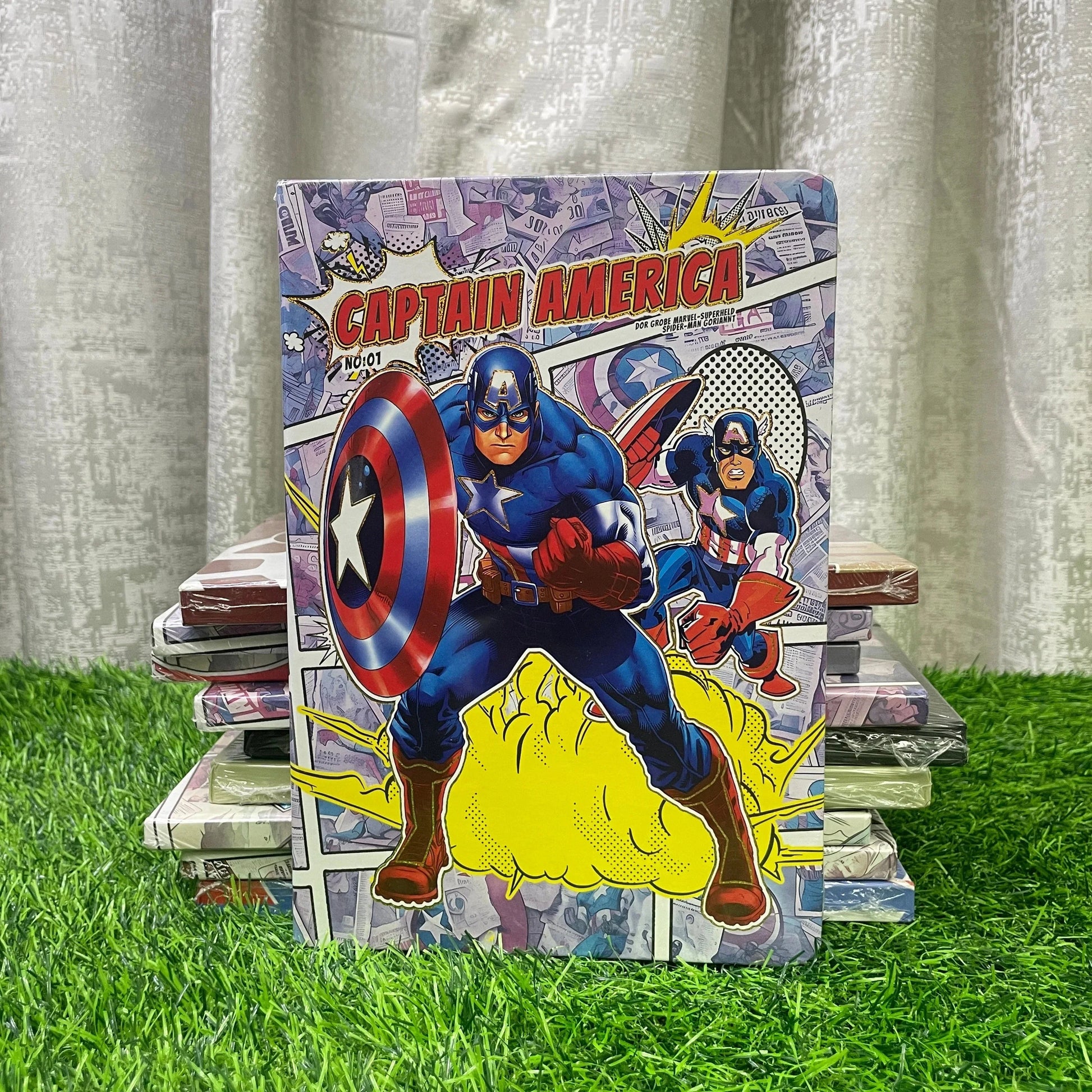 Comic book cover featuring Captain America on a grassy surface with a curtain background