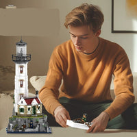Person building a model of a lighthouse with text in the background