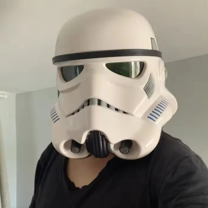 Person wearing a white stormtrooper helmet indoors