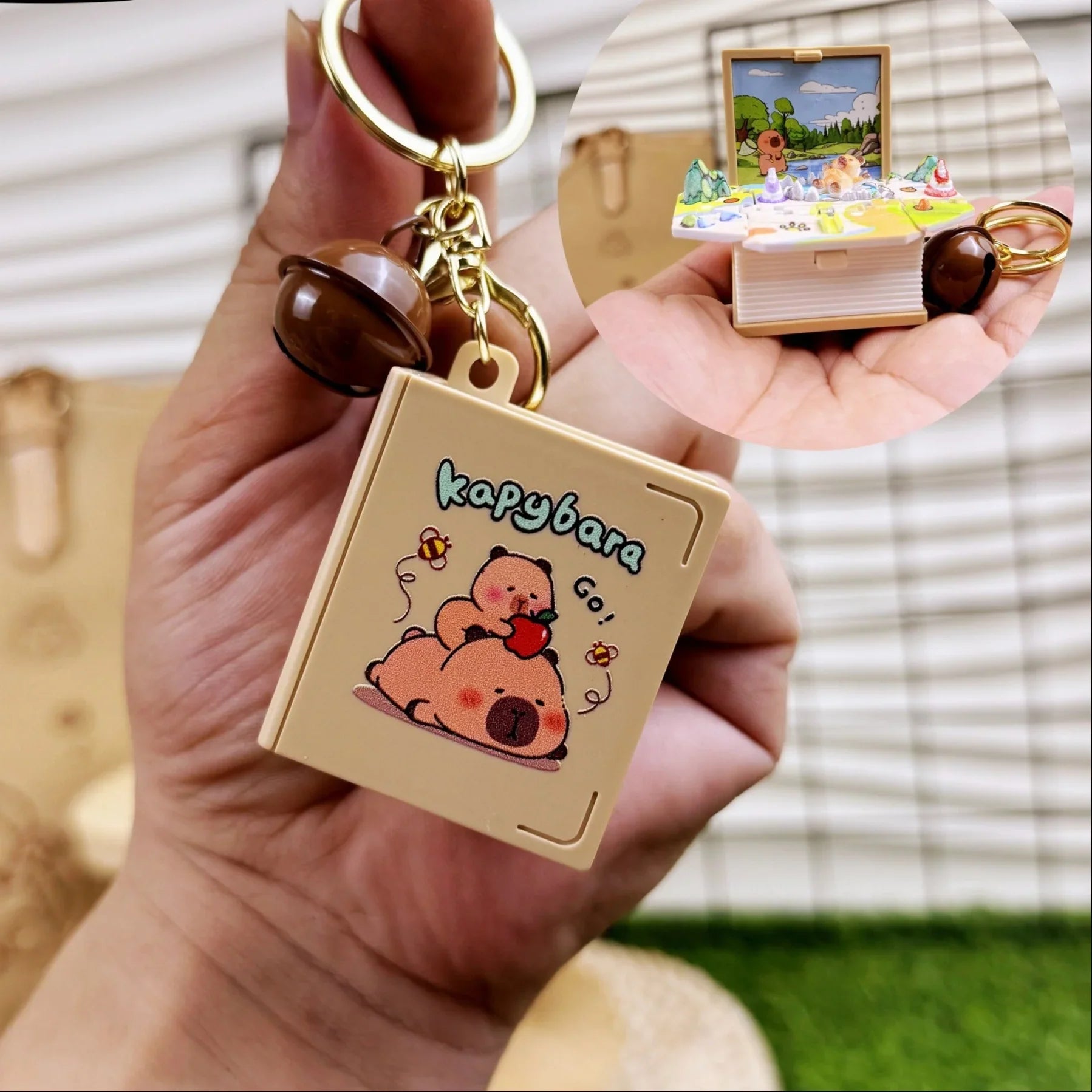 Keychain with cartoon character design held by a hand