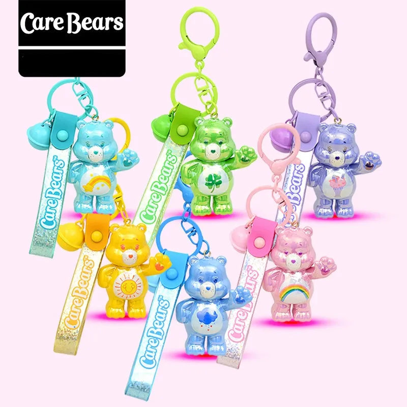 Set of Care Bears keychains with colorful ribbons on a white background