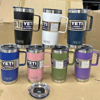 Collection of colorful YETI tumblers on a cardboard surface