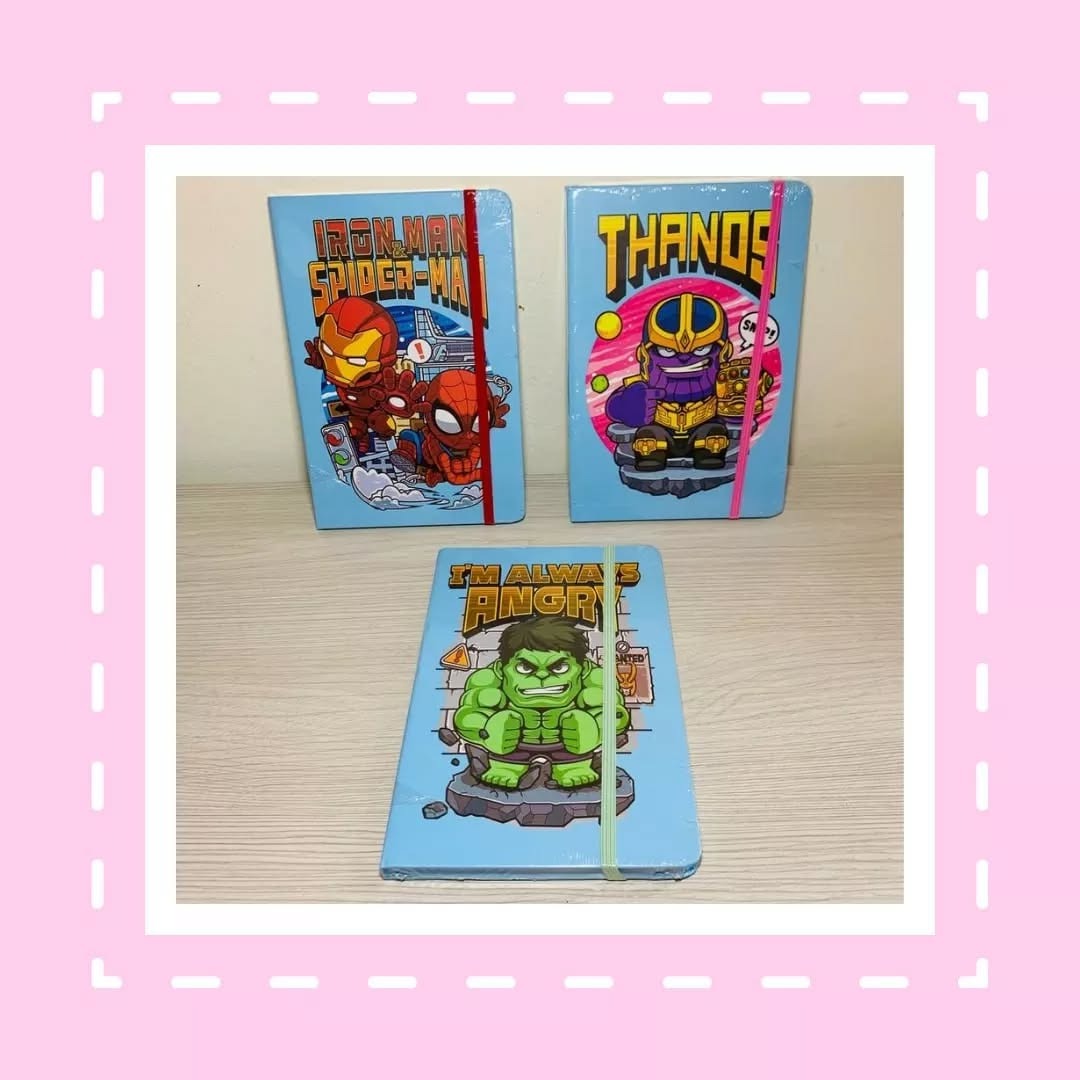 Three superhero-themed notebooks with Iron Man, Spider-Man, and Thanos on a pink border.