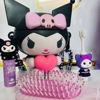 Cartoon character with a heart-shaped design, hairbrush, and small figures on a white surface.