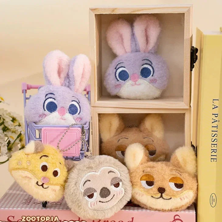 Plush toys resembling characters from Zootopia and Disney's 'Bread' in a wooden box with a yellow book titled 'La Patisserie'.