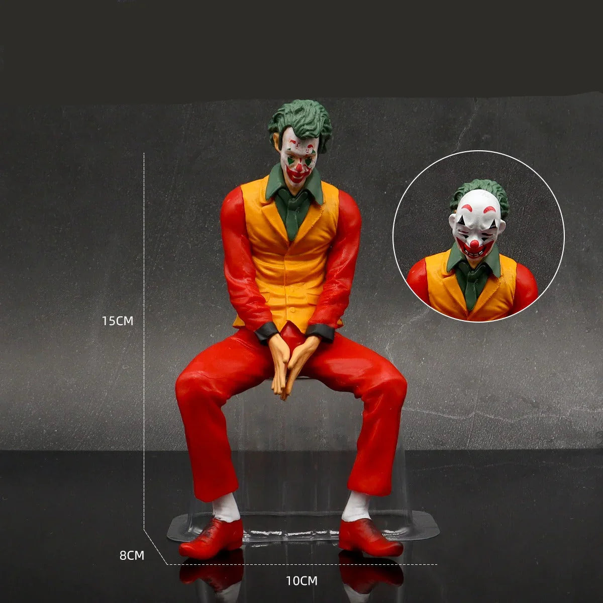 Joker figurine with green hair and clown makeup on a gray background
