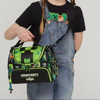 Girl holding a Minecraft-themed bag with a plain background