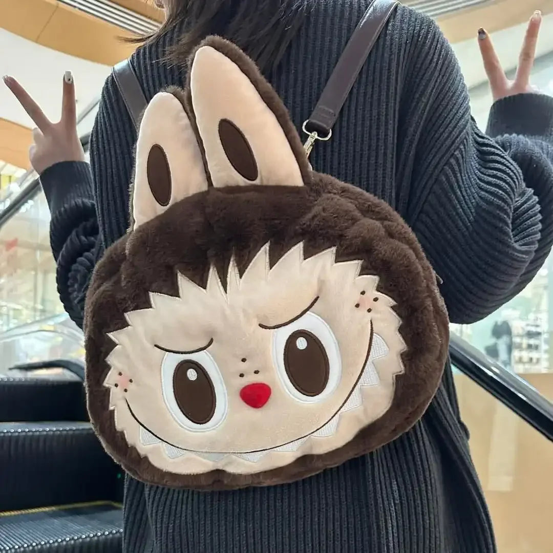Person wearing a plush backpack with a cartoon face design.