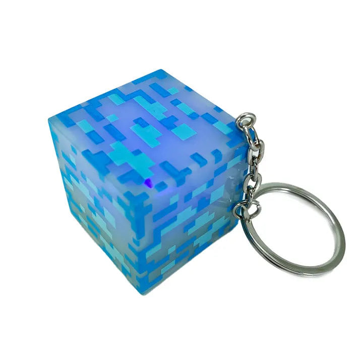 Blue pixelated cube keychain on a white background