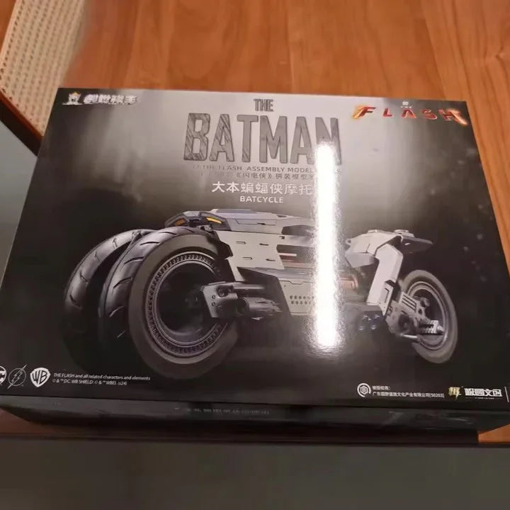 Box of a Batman-themed model kit on a wooden surface