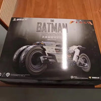 Box of a Batman-themed model kit on a wooden surface