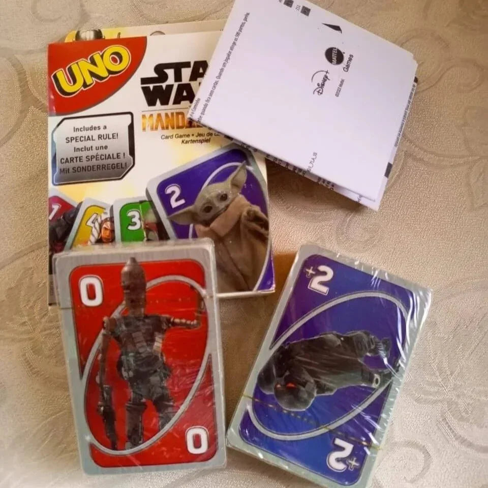 Card game packaging with cards featuring characters from a popular franchise on a patterned surface.