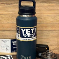 Blue YETI Rambler bottle with a wooden background