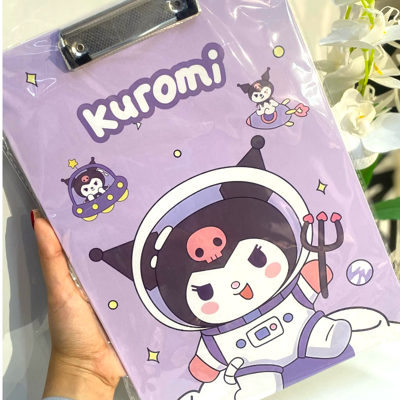 Purple folder with Kuromi character design held by a hand, with flowers in the background.