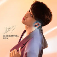 Person wearing B&O wireless earphones with promotional text on a gradient background