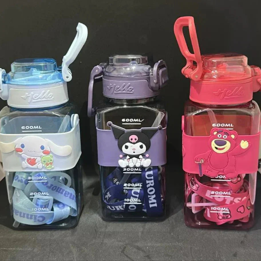 Three colorful water bottles with cartoon designs on a dark background