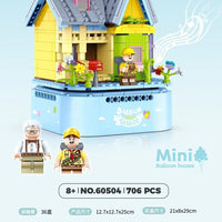 Music Box toy set with colorful balloons and house design, featuring GUDI brand.