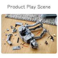 Star Wars AT-AT model kit on a wooden surface with building pieces, and completed model on a table.