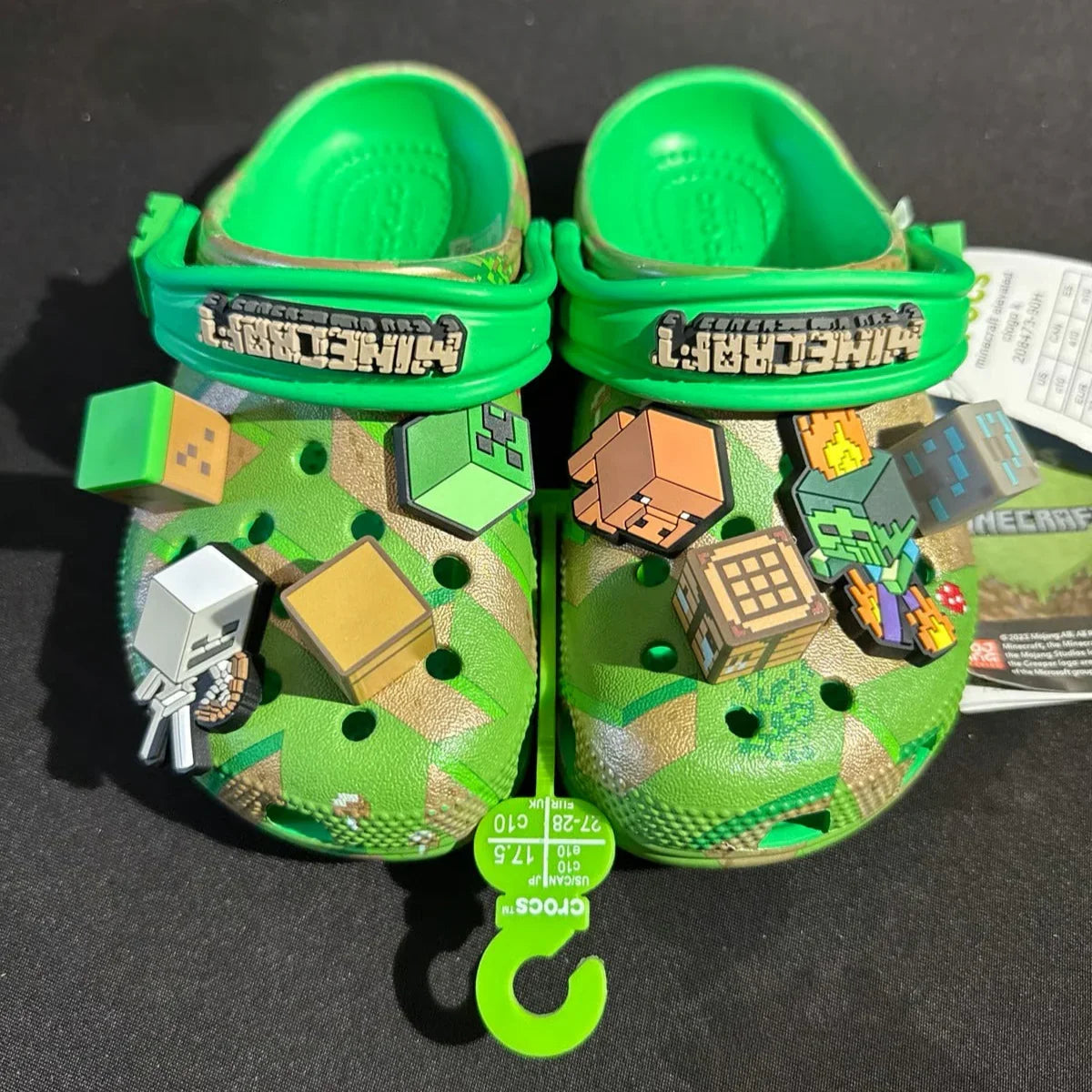 Green children's crocs with Minecraft design on a black background