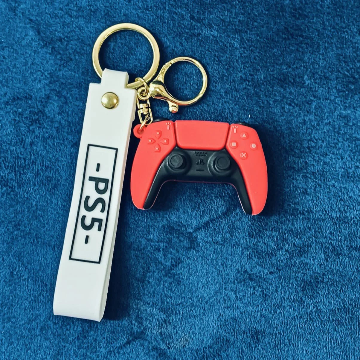 Keychain with red gaming controller design and 'PS5' tag on a blue background