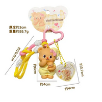 Set of four colorful keychains with bear designs and measurements on a white background