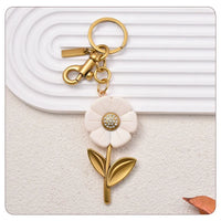 Trainer Luxe TS I Turned Pretty Daisy Bag Charm